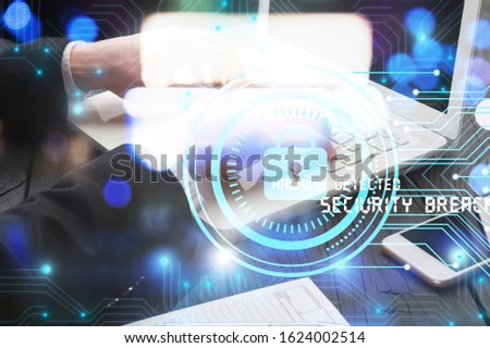 Digital cybersecurity and network protection concept. Businessman working at laptop