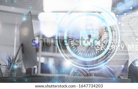 Digital cybersecurity and network protection concept. Businessman working at laptop