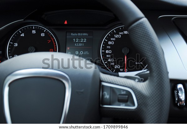 Digital\
dashboard, gear and steering in the\
cockpit