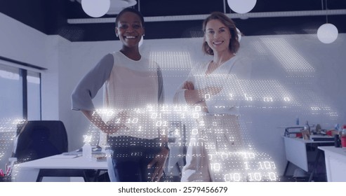 Digital data processing image over two businesswomen standing in modern office. technology, data analysis, teamwork, collaboration, professional, corporate