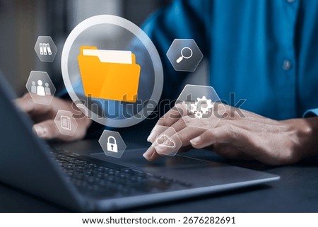 Digital data storage technology document file concept, digital document files stored on servers. Businessman use laptop with virtual icon.
