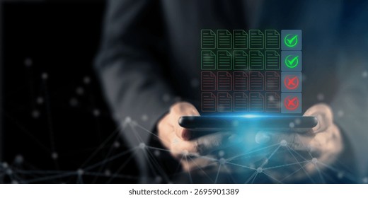 Digital Data Verification and Validation System. Holding a tablet displaying glowing icons of documents with green checkmarks and red X marks, digital data verification, approval and accuracy control.