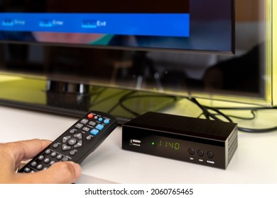 Digital decoder for new television transmission with remote control and television monitor.