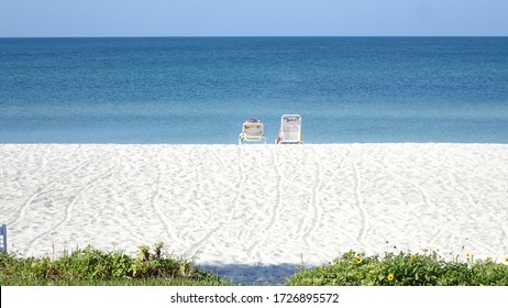 Digital detoxing relaxing on beach chair on a calm morning at Golf of Mexico Longboat Key Sarasota Florida USA