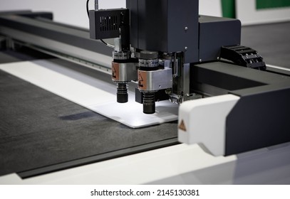 Digital die cutter machine cutting PP flute board. Industrial manufacture. - Powered by Shutterstock