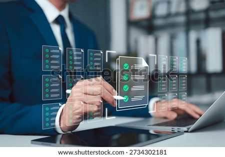 Digital document management concept showing business approval workflow, checklist verification, and compliance review, with professional using laptop and tablet to validate files in office environment