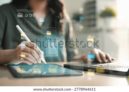 Digital document management system with cloud storage, file transfer and data export interface on tablet and laptop for secure workflow.