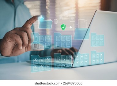 Digital document management system concept. secure cloud storage. DMS. Data organization, File sharing, Store encrypted files. Enterprise solutions. Businessman using laptop saving classifying files.