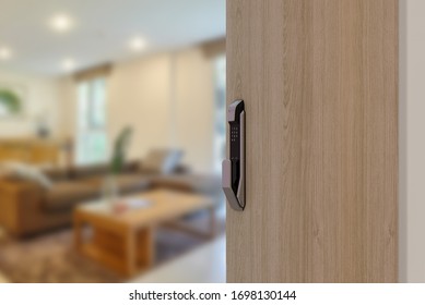 Digital Door handle or Electronics knob  for access to room security, Door wooden half opening through interior living room background, selective focus - Shutterstock ID 1698130144
