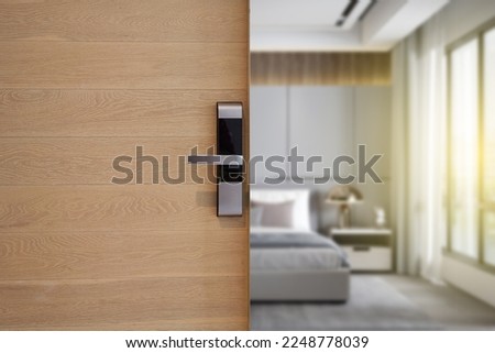 Digital Door handle or Electronics knob  for access to room security, Door wooden half opening through interior bedroom background, selective focus                          