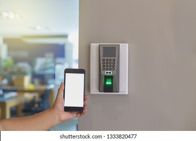 Digital door lock systems control by mobile phone for access security and protection. Man or woman user mobile for access digital door lock systems. Selective focus. - Shutterstock ID 1333820477