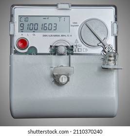 Digital Electricity Meter Isolated On Gray Background