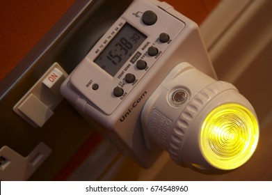 DIGITAL ELECTRONIC TIMER FOR ELECTRICAL APPLIANCES PLUGGED INTO 13 AMP MAINS SOCKET WITH ENERGY SAVING LED NIGHT LIGHT, DEWSBURY, WEST YORKSHIRE, UK, CIRCA 2006
