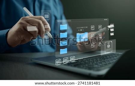 Digital file management and cloud document storage concept with virtual folders and data organization interface on laptop. Online backup, secure document management and business workflow system. DMS