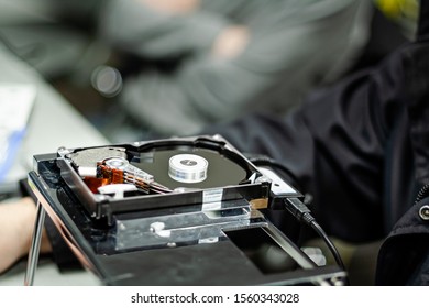 A Digital Forensics Student Takes Apart A Broken Hard Disk Drive To Repair It