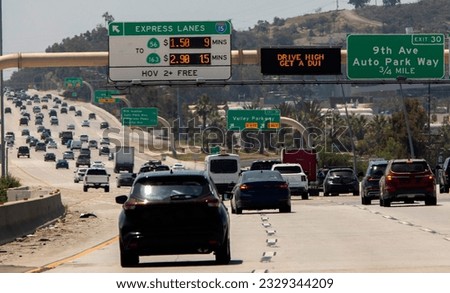 Digital freeway sign stating Drive High, Get a DUI 