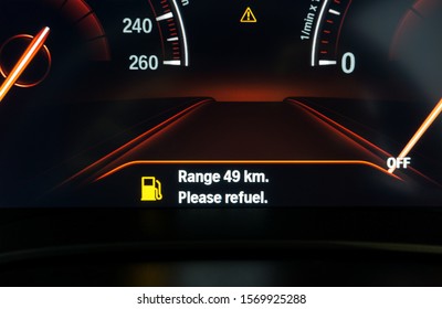 Digital Fuel Gauge Empty Tank Car On Dashboard. Modern Technology Of Car In The Display Of The Calculation Range Of The Distance To Which The Car Can Drive