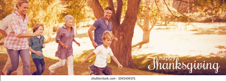 Digital generated image of thanksgiving greeting against happy family playing soccer - Powered by Shutterstock