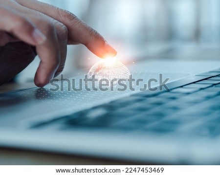 Digital global network technology expansion, business marketing and technology management concepts. Virtual digital earth on mesh appearing while fingertips touching on touchpad on laptop computer. Foto stock © 