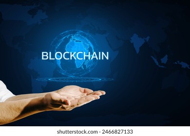 A digital globe floating above a hand with the word BLOCKCHAIN illuminated, set against a blue background world map