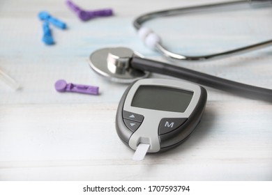 Digital Glucometer And Lancet Pen, Stethoscope, Blood In Vitro, On White Background, Concept Of Health, Medical Technology, Patient Monitoring