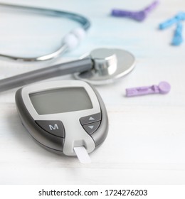 Digital Glucometer And Lancet Pen, Stethoscope, Blood In Vitro, On White Background, Concept Of Health, Medical Technology, Patient Monitoring