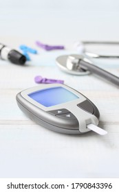 Digital Glucometer And Lancet Pen, Stethoscope, Blood In Vitro, On White Background, Concept Of Health, Medical Technology, Patient Monitoring