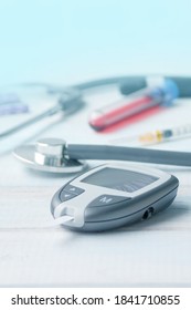 Digital Glucometer And Lancet Pen, Stethoscope, Blood In Vitro, On White Background, Concept Of Health, Medical Technology, Patient Monitoring