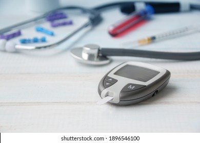 Digital Glucometer And Lancet Pen, Stethoscope, Blood In Vitro, On White Background, Concept Of Health, Medical Technology, Patient Monitoring