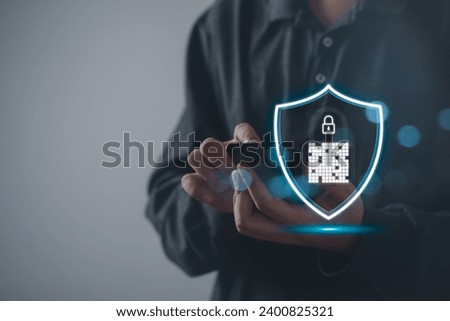 Digital graphic Shield lock button and personal information icons appeared while man using Smart mobile phone. Cyber security, network data protection, business privacy digital technology concept.