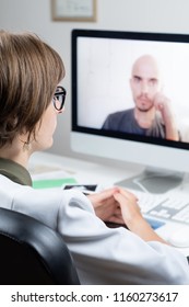 Digital Health Concept: Practicing Physician Having Online Appointment With A Patient. Medical Doctor Consulting A Person By Means Of Web Conference System