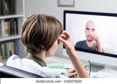 Digital Health Concept: Practicing Physician Having Online Appointment With A Patient. Medical Doctor Consulting A Person By Means Of Web Conference System