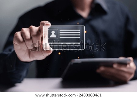 Digital identification or digital ID concept. Accessing databases by digital identity for cyber security. Businessman show digital identification card on virtual screen. 