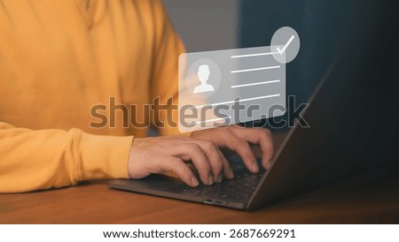Digital identity verification and user authentication concept showing a person typing on a laptop with a virtual ID card and check mark symbolizing secure login, data privacy, and account approval.