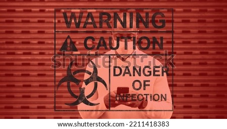 Digital illustration of a warning sign with a hazard sign with warning, caution, danger of infection signs over a man wearing a face mask, standing on a street, using a smartphone in the background.
