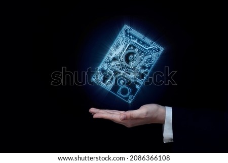 digital information storage concept electronic chip in the hands of a businessman, big data and cloud computing