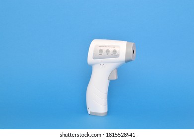 Digital Infrared Forehead Thermometer On Blue Background