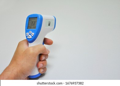 Digital Infrared Thermometer (thermometer gun) for check forehead temperature measurement screening from Coronavirus Disease 2019 (COVID-19). White background