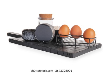 Digital kitchen timer, dishware and ingredients on white background