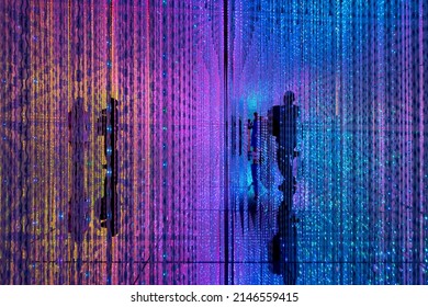 Digital Life concept. Abstract of shadow of person standing in middle of a room full of infinite colorful LED light illumination.