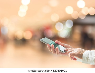 Digital Lifestyle Business Person Or Shopper Using Mobile Smart Phone For Retail Shopping In Mall