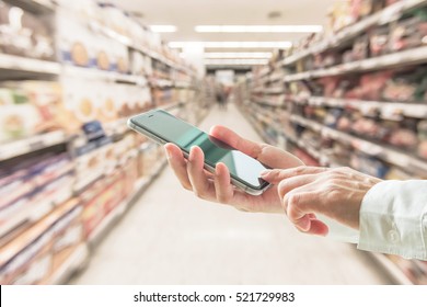 Digital Lifestyle Business Person Or Shopper Using Mobile Smart Phone For Retail Shopping In Supermarket 