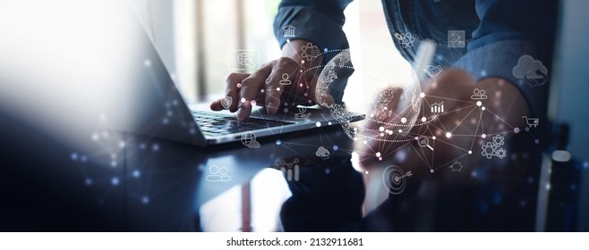 Digital marketing, Business Strategy, E-commerce, Internet of Things IoT concept. Businessman using tablet and laptop with interface icons, global network connection, digital technology background