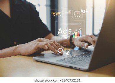 Digital marketing concept, Young man using laptop with Ads dashboard digital marketing strategy analysis for branding. - Shutterstock ID 2340752131