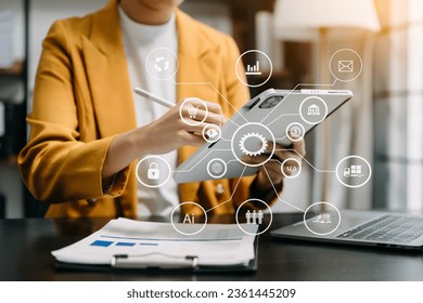 Digital marketing media in virtual screen.business woman hand working with mobile phone and modern compute with VR icon diagram at office in morning light - Shutterstock ID 2361445209