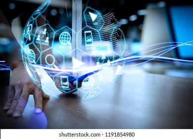 Digital marketing media (website ad, email, social network, SEO, video, mobile app) in virtual globe shape diagram.Waves of blue light and businessman using on smartphone as concept - Shutterstock ID 1191854980
