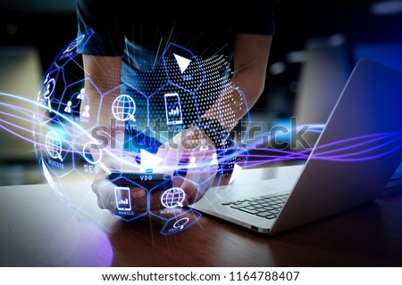 Digital marketing media (website ad, email, social network, SEO, video, mobile app) in virtual globe shape diagram.Waves of blue light and businessman using on smartphone as concept