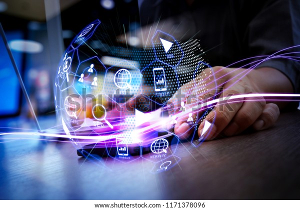 Digital\
marketing media (website ad, email, social network, SEO, video,\
mobile app) in virtual globe shape diagram.Waves of blue light and\
businessman using on smartphone as\
concept