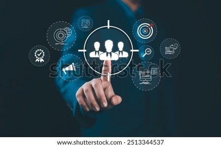 Digital marketing targeting concept. Businessman with marketing icons represent targeting, customer engagement. global reach, Modern strategies in online marketing, customer acquisition, sales growth,