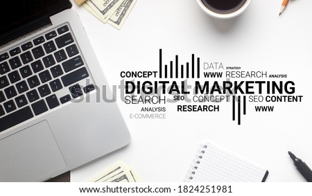 Digital Marketing Wordcloud Over White Office Desk Background With Laptop Computer. Internet Business Promotion Strategy And Online Content Planning Concept. Top View, Collage With Text
